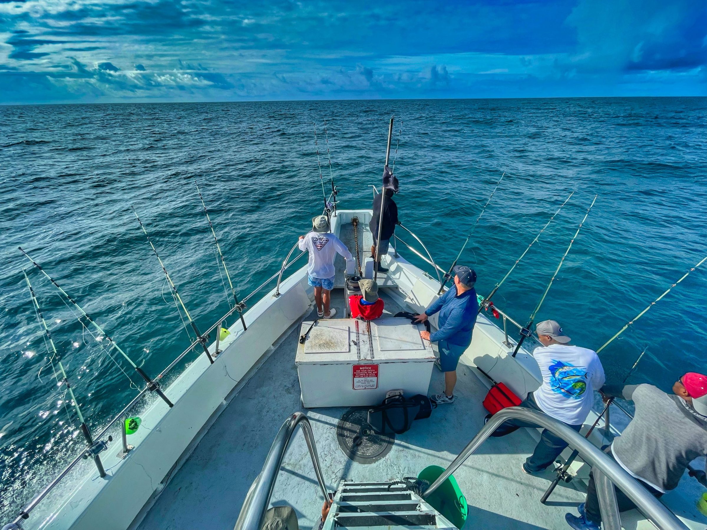 a group of people on a boat in the water